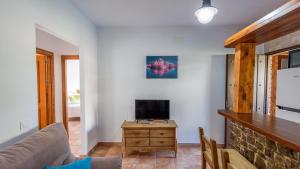 A television and/or entertainment centre at Apto El Descanso II Conil de la Frontera by Ruralidays