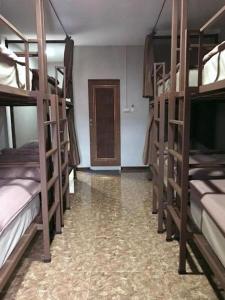 Postel nebo postele na pokoji v ubytování Chato Hostel