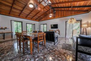 a dining room with a table and chairs at Azania Oasis in Puerto Viejo