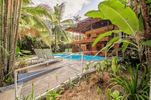 a villa with a swimming pool in a resort at Azania Oasis in Puerto Viejo