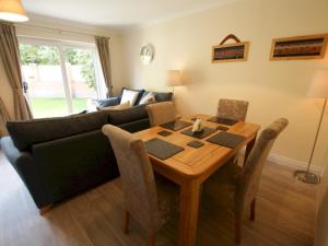 a living room with a table and a couch at Pass the Keys Homely and central with parking in Exeter