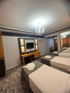 Кровать или кровати в номере Ünaten otel