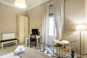 TV a/nebo společenská místnost v ubytování Dedalo Rooms