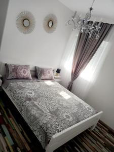 Postel nebo postele na pokoji v ubytování Amellia