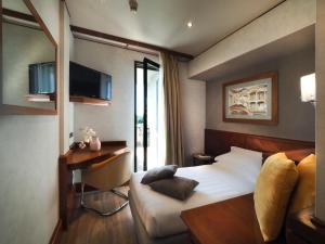 TV a/nebo společenská místnost v ubytování Perugia Park Hotel