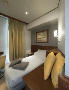 Postel nebo postele na pokoji v ubytování Perugia Park Hotel