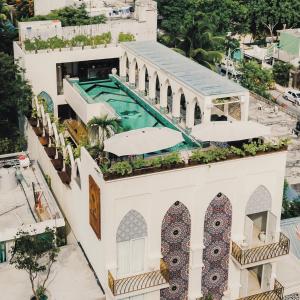 an aerial view of a building with a swimming pool at Layla Tulum - Adults Only in Tulum
