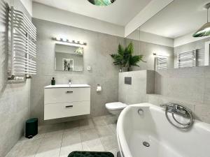 Kúpeľňa v ubytovaní LuxApart Kalisz Loft