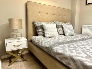 Ένα ή περισσότερα κρεβάτια σε δωμάτιο στο LuxApart Kalisz Loft