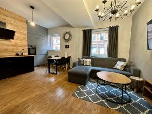 Televízia a/alebo spoločenská miestnosť v ubytovaní LuxApart Kalisz Loft