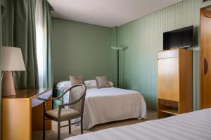 Postel nebo postele na pokoji v ubytování Perugia Park Hotel