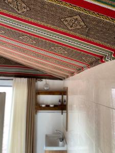 a ceiling in a bathroom with a shower curtain at Martian desert Camp in Wadi Rum