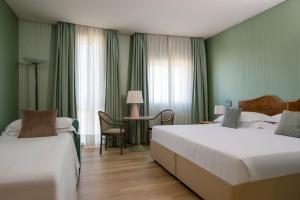 Postel nebo postele na pokoji v ubytování Perugia Park Hotel