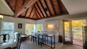 a kitchen and dining room with a table and chairs at The Elizabeth Inn and Restaurant in Bethel