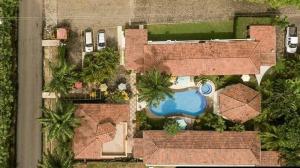 an aerial view of a house with a swimming pool at Las Brisas Resort and Villas in Jacó