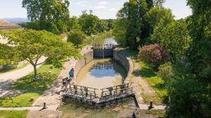 an aerial view of a canal with people walking along it at Vivez une experience unique a Carcassonne in Carcassonne