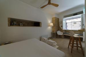 Postel nebo postele na pokoji v ubytování Apartment Don Giuliano Centro