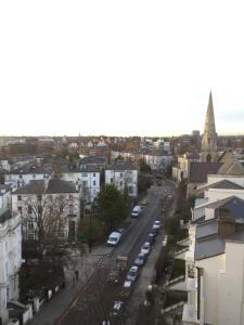 a city street with a church in the distance at Amazing view 2 bedroom in Abbey Road in London