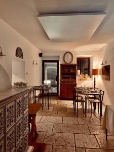 a kitchen with a dining room with tables and chairs at Agriturismo Mas dei Chini in Trento