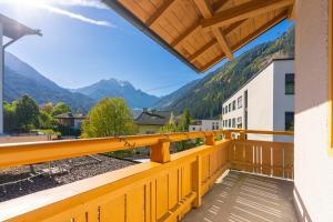 a balcony with a view of mountains at das Cityhouse in Mayrhofen