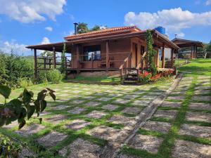 a house with a large yard in front of it at Estância Liberdade in Santo Antônio do Pinhal
