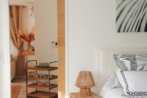 a bedroom with a bed and a table with a lamp at Chambre d'hôtes A Vadina Porticcio in Porticcio