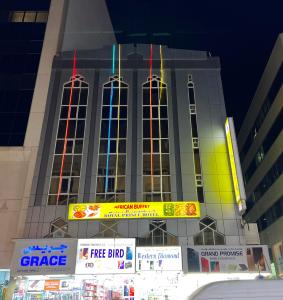 a large building with stained glass windows on it at Royal Prince Hotel in Dubai