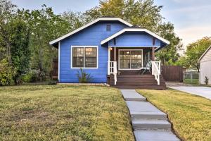 a blue tiny house with a front porch at Lovely Historic Fort Worth Home about 6 Mi to Dtwn! in Fort Worth