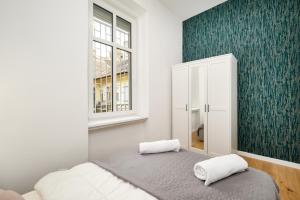 Posteľ alebo postele v izbe v ubytovaní Modern Penthouse in a Century Old Building- 2 BR- AC