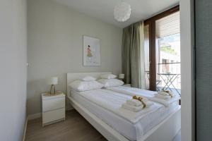 Postel nebo postele na pokoji v ubytování GO Apartments - ApartHotel