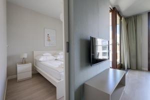 Postel nebo postele na pokoji v ubytování GO Apartments - ApartHotel