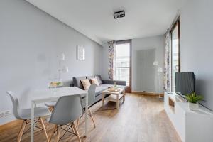 TV a/nebo společenská místnost v ubytování GO Apartments - ApartHotel