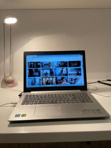 a laptop computer sitting on top of a table at Apartamentos Torrelaguna in Vera