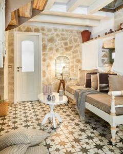 a living room with a couch and a table at Estia Residence in Chania Old Town in Chania