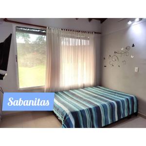 Cama o camas de una habitación en Casa campestre sabanitas