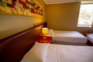 Voodi või voodid majutusasutuse Hotel Nevados de Chillan toas