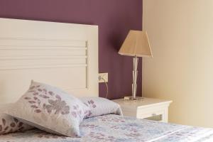 A bed or beds in a room at Apartmento en Torrox Costa