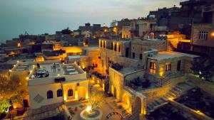 an aerial view of a city at night at Nostalji in Mardin
