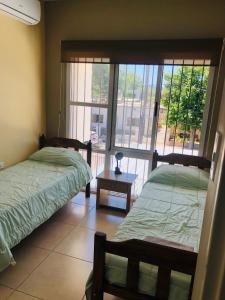 Ένα ή περισσότερα κρεβάτια σε δωμάτιο στο Hermoso Duplex c/Pileta y Cochera en Consorcio Privado Saavedra