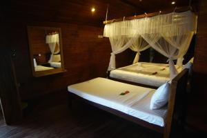 Postel nebo postele na pokoji v ubytování Turtle Bay Beach Resort