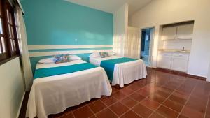 Postel nebo postele na pokoji v ubytování Calypso Beach Hotel