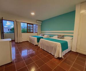 Postel nebo postele na pokoji v ubytování Calypso Beach Hotel