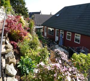 a house with a bunch of flowers in front of it at Arakhova in Kirkcudbright