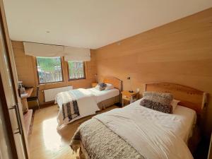 Postel nebo postele na pokoji v ubytování Palafito 1326 Hotel Boutique Chiloé