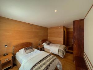 Postel nebo postele na pokoji v ubytování Palafito 1326 Hotel Boutique Chiloé