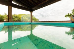a swimming pool with a view of the water at Hacienda Maria Eugenio in Guanajuato