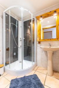 a bathroom with a shower and a sink at Gite de la voie verte gitesdes2vallees in Cornimont +23 photos