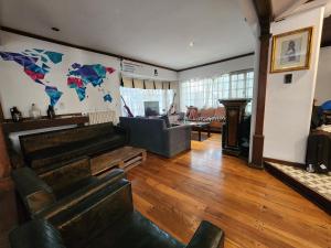 a living room with a couch and a table at Gorilla Hostel in Mendoza
