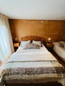 Postel nebo postele na pokoji v ubytování Palafito 1326 Hotel Boutique Chiloé