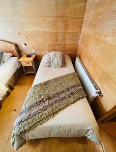 Postel nebo postele na pokoji v ubytování Palafito 1326 Hotel Boutique Chiloé